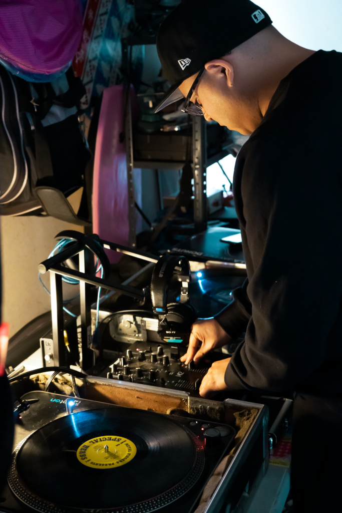 Photo of Chris mixing his records at home